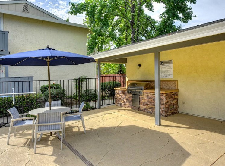 Rocklin, CA Apartments for Rent - The Everette Outdoor BBQ Area with Picnic Table and Access to Pool